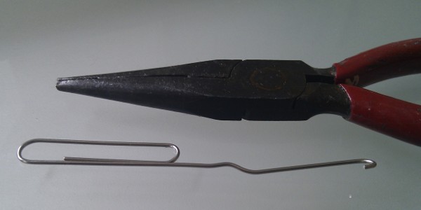 A paper clip, and trusty but battered needle-nosed pliers.